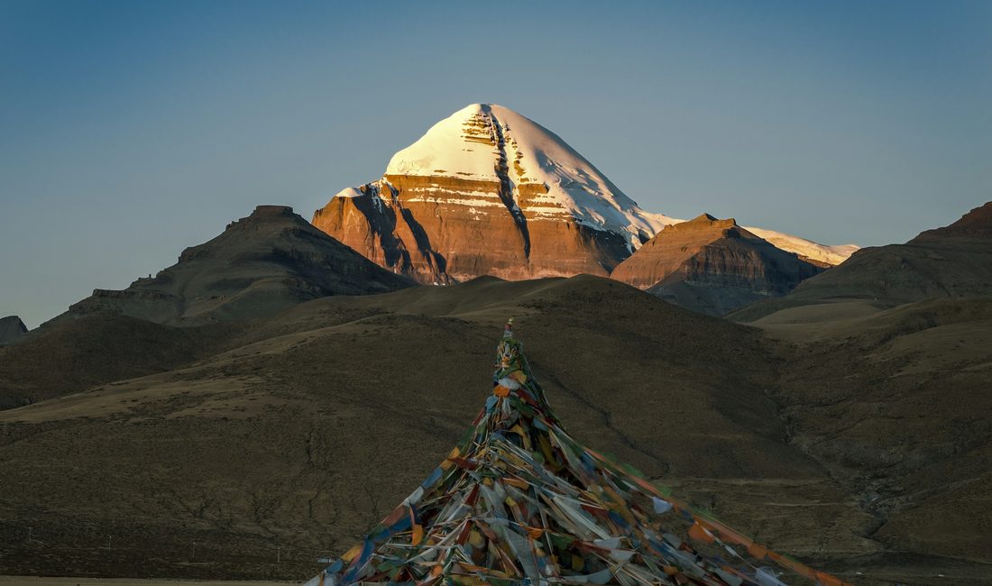 Mount Kailash at sunrise with prayer flags